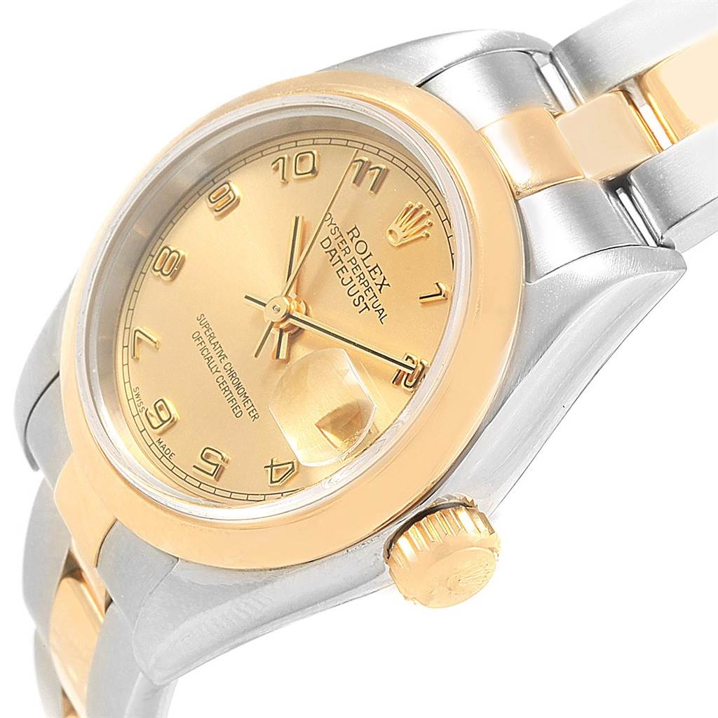 The image shows a close-up angled view of a Rolex Datejust 79163 Women's Steel and Gold (two tone) Champagne Dial 79163 Women's Steel and Gold (two tone) Champagne Dial watch, highlighting its gold dial, crown, and part of the bracelet.