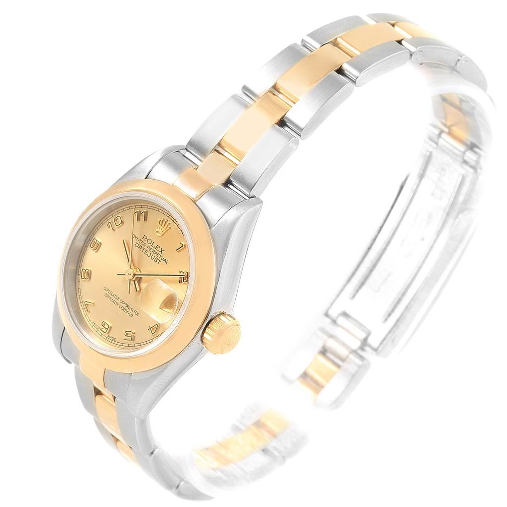 The image shows a Rolex Datejust 79163 Women's Steel and Gold (two tone) Champagne Dial 79163 Women's Steel and Gold (two tone) Champagne Dial watch at a 3/4 angle, highlighting its gold dial, bezel, crown, and two-tone bracelet.