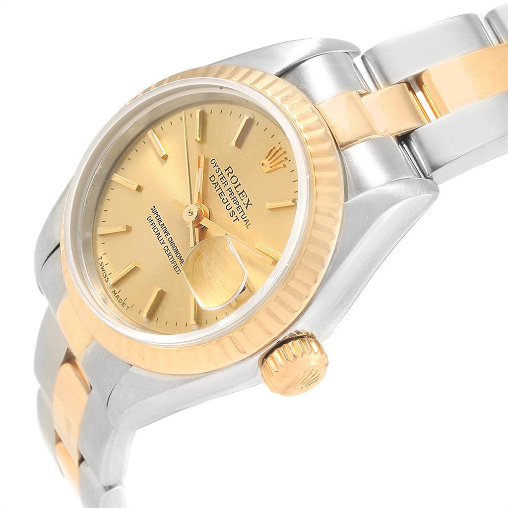 This Rolex Datejust 69173 Women's Steel and Gold (two tone) Champagne Dial 69173 Women's Steel and Gold (two tone) Champagne Dial watch is shown at a slight angle, highlighting the gold dial, fluted bezel, and two-tone bracelet.