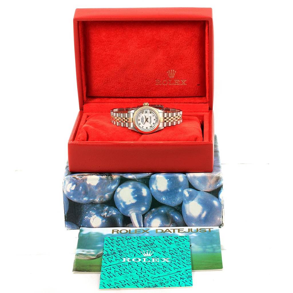 The Rolex Datejust 69173 Women
s Stainless Steel White Dial 69173 Women
s Stainless Steel White Dial watch is shown from the front in an open red box with accompanying booklets.