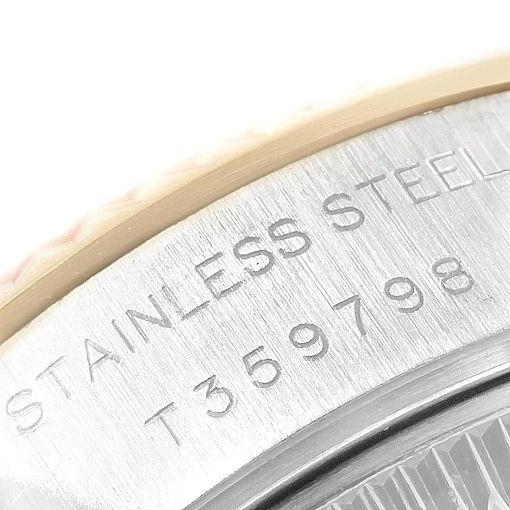 This close-up image shows the bezel and part of the stainless steel case of a Rolex Datejust 69173 Women
s Stainless Steel White Dial 69173 Women
s Stainless Steel White Dial watch.
