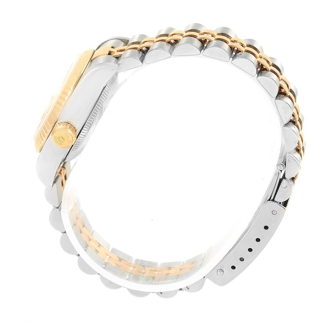 The image shows a side view of a Rolex Datejust 69173 Women
s Stainless Steel White Dial 69173 Women
s Stainless Steel White Dial watch with its crown and two-tone bracelet clearly visible.