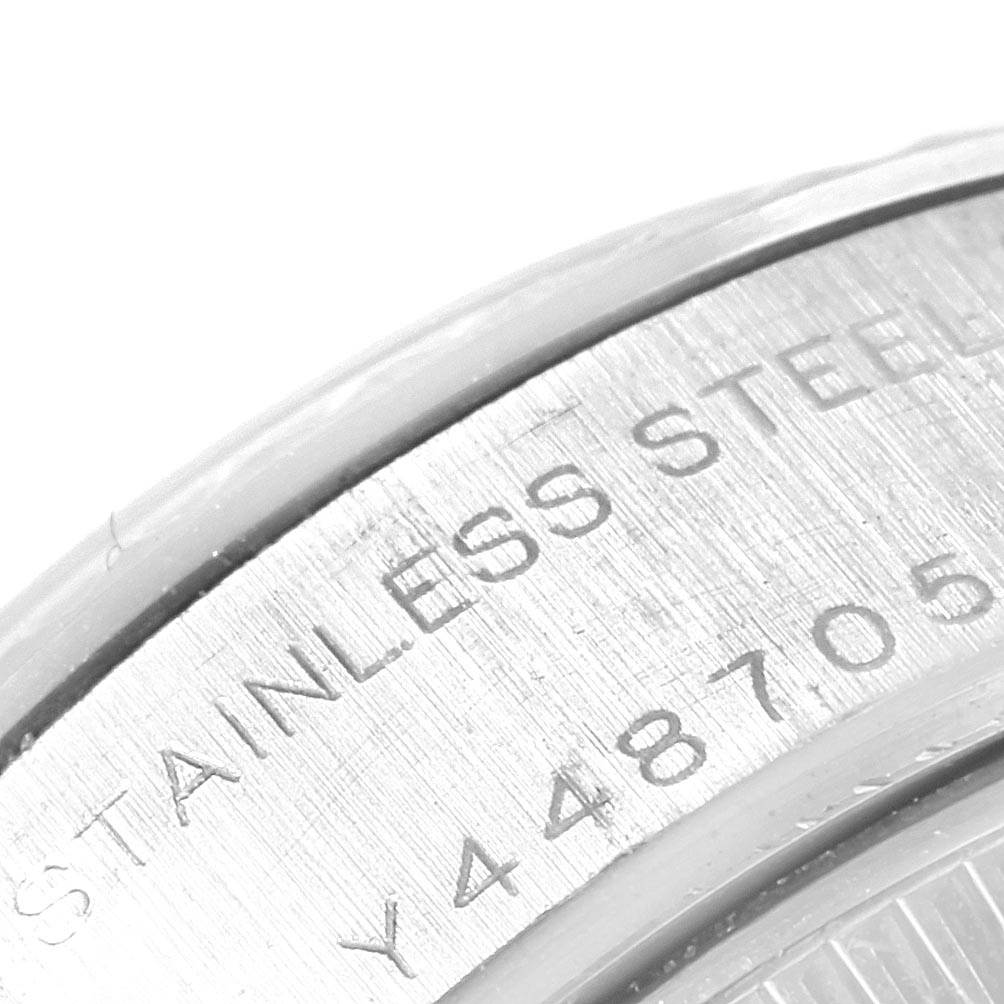 The image shows a close-up of the case back and serial number engraving on a Rolex Datejust 79174 Women
s Stainless Steel Pink Dial 79174 Women
s Stainless Steel Pink Dial.