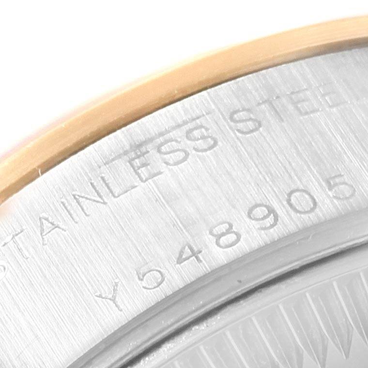 This image shows a close-up of the case back and serial number of a Rolex Datejust 79163 Women's Steel and Gold (two tone) White Dial 79163 Women's Steel and Gold (two tone) White Dial watch.