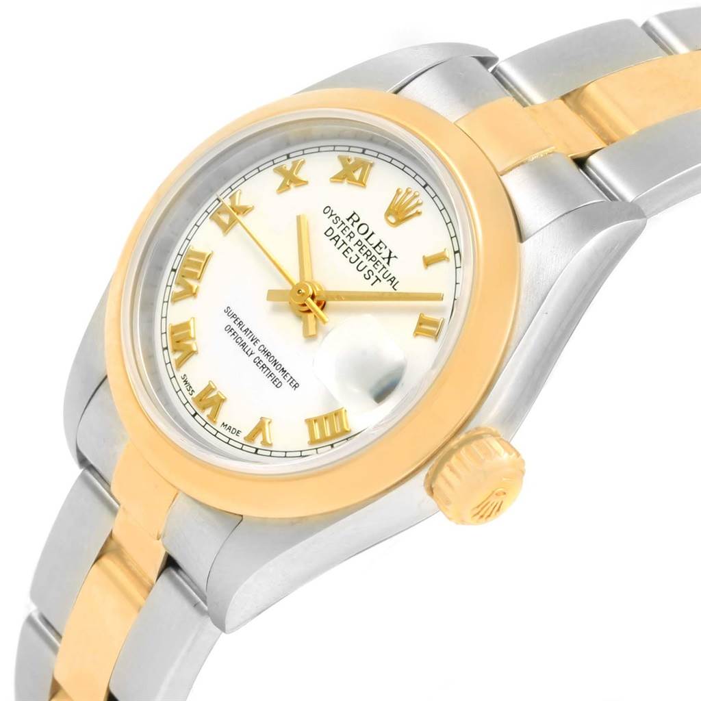 The image shows a Rolex Datejust 79163 Women's Steel and Gold (two tone) White Dial 79163 Women's Steel and Gold (two tone) White Dial watch at a tilted angle, highlighting the face, crown, bezel, and part of the bracelet.