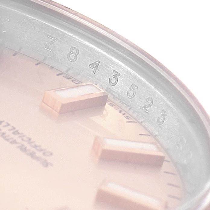 The image shows a close-up of the dial and serial number ring of the Rolex Datejust 179171 Women's Steel and Gold (two tone) Pink Dial 179171 Women's Steel and Gold (two tone) Pink Dial watch.