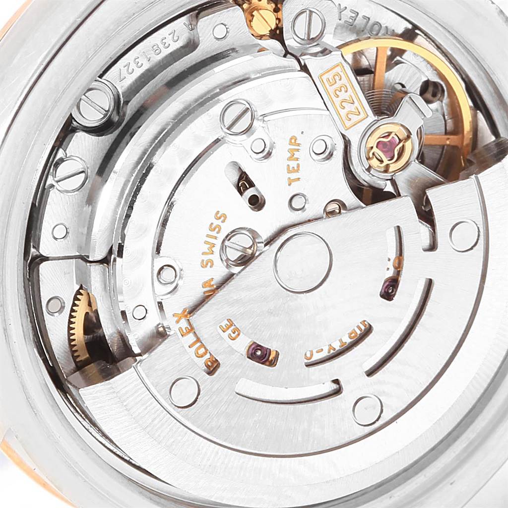 The image shows the movement and internal mechanism of a Rolex Datejust 179171 Women's Steel and Gold (two tone) Pink Dial 179171 Women's Steel and Gold (two tone) Pink Dial watch from a close-up, detailed angle.