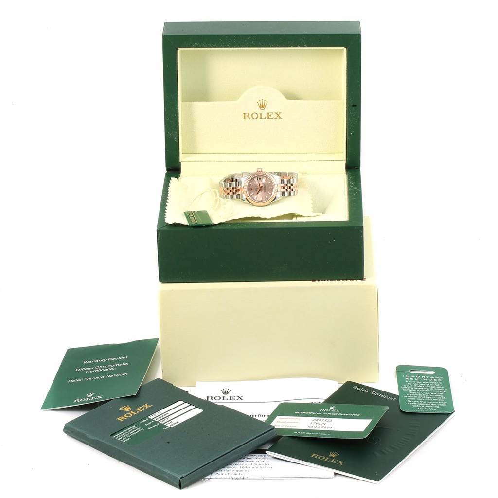This image shows a Rolex Datejust 179171 Women's Steel and Gold (two tone) Pink Dial 179171 Women's Steel and Gold (two tone) Pink Dial watch in an open case along with its warranty booklets and tags.