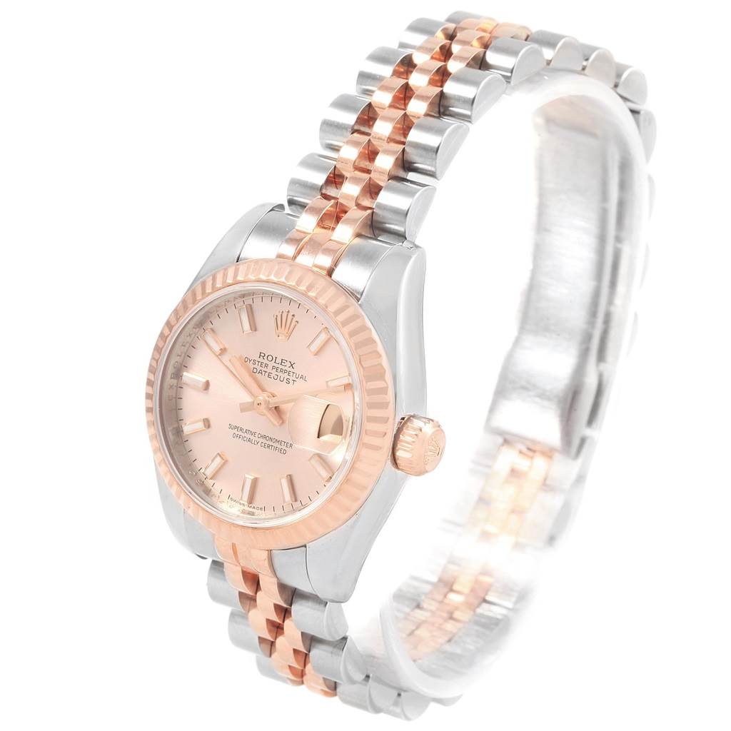 The Rolex Datejust 179171 Women's Steel and Gold (two tone) Pink Dial 179171 Women's Steel and Gold (two tone) Pink Dial watch is photographed at a slight angle showcasing the face, crown, bezel, and two-tone bracelet.