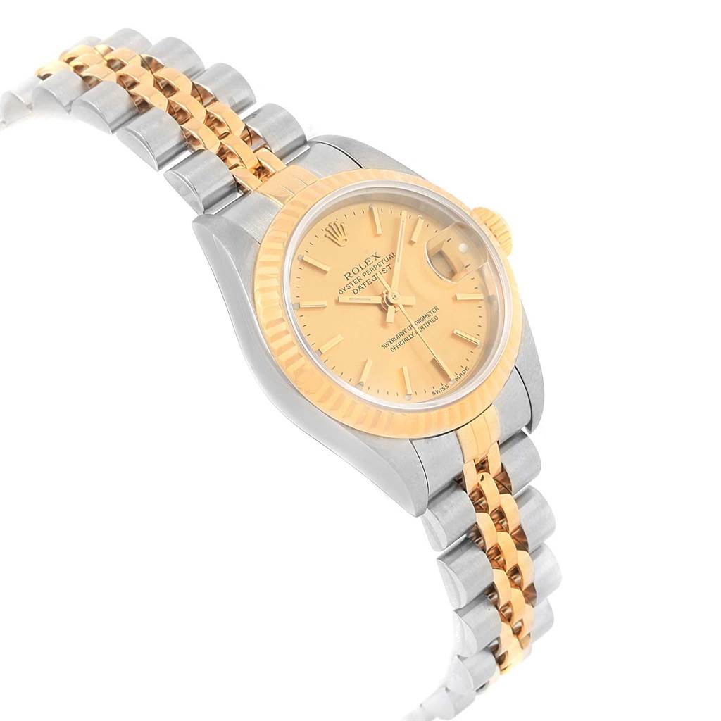 This image shows a Rolex Datejust 79173 Women's Steel and Gold (two tone) Champagne Dial 79173 Women's Steel and Gold (two tone) Champagne Dial watch at a slight angle highlighting its dial, bezel, and two-tone bracelet.