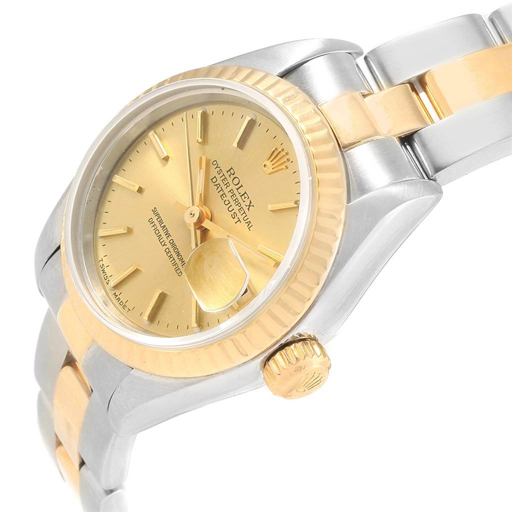 The image shows the Rolex Datejust 69173 Women
s Stainless Steel Champagne Dial 69173 Women
s Stainless Steel Champagne Dial watch at an angled close-up, highlighting its gold dial, bezel, and bracelet.