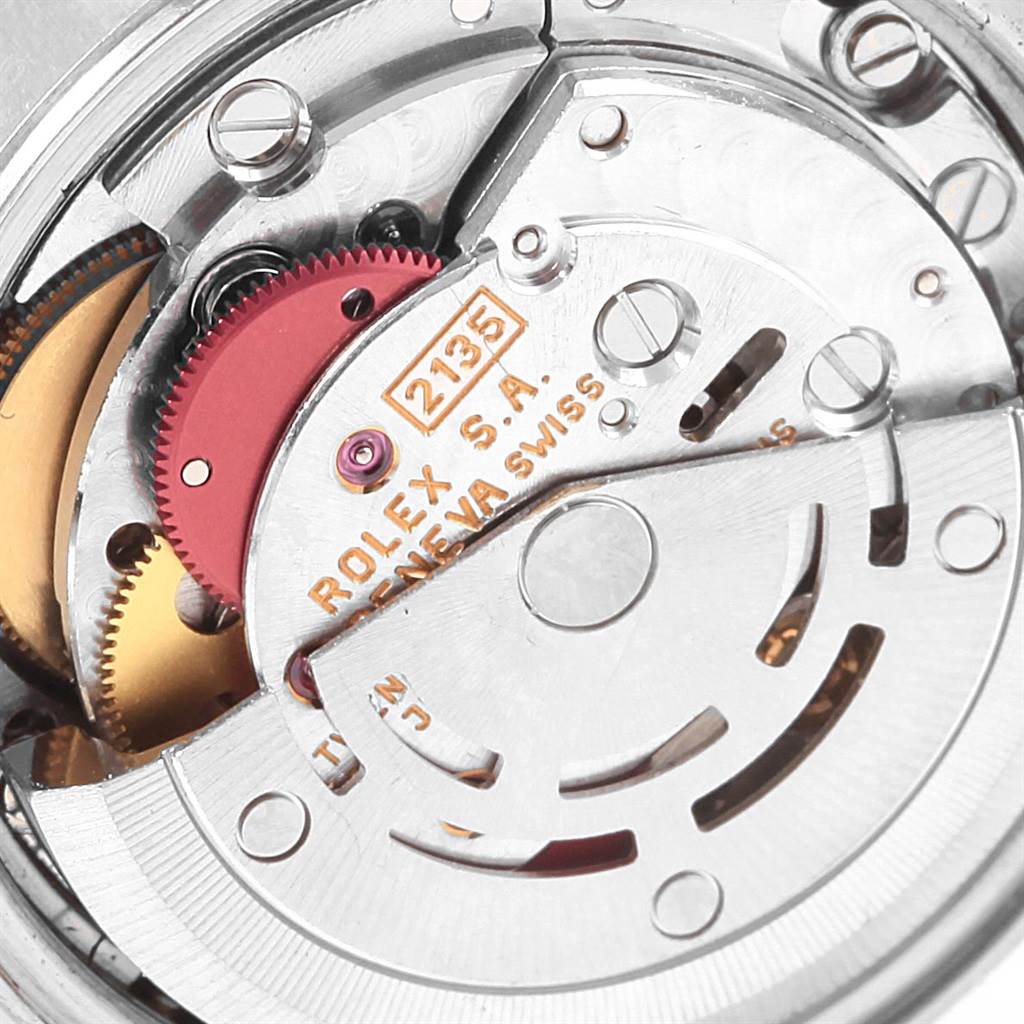 This image shows the intricate internal mechanism of the Rolex Datejust 69173 Women
s Stainless Steel Champagne Dial 69173 Women
s Stainless Steel Champagne Dial watch, particularly its movement, gears, and rotor.
