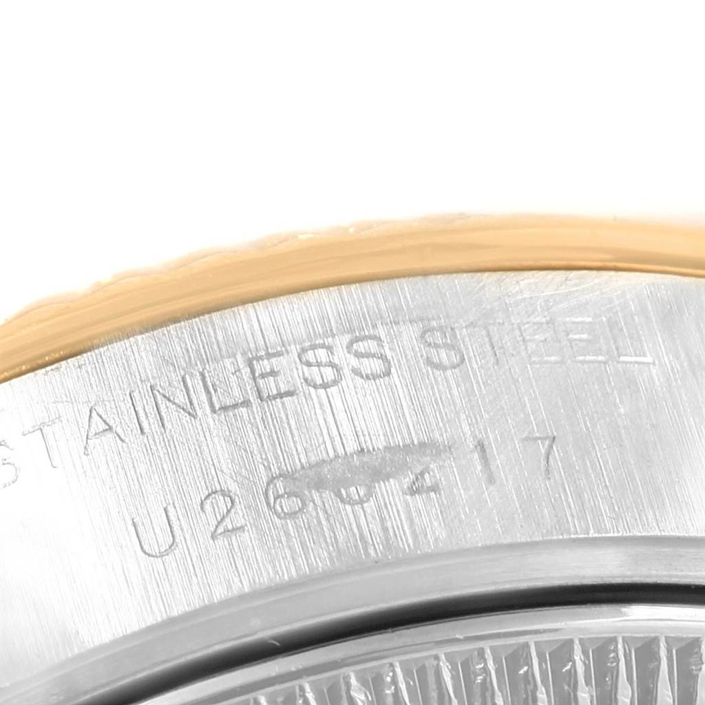 This image shows a close-up angle of the serial number engraved on the side of a Rolex Datejust 69173 Women
s Stainless Steel Champagne Dial 69173 Women
s Stainless Steel Champagne Dial watch.