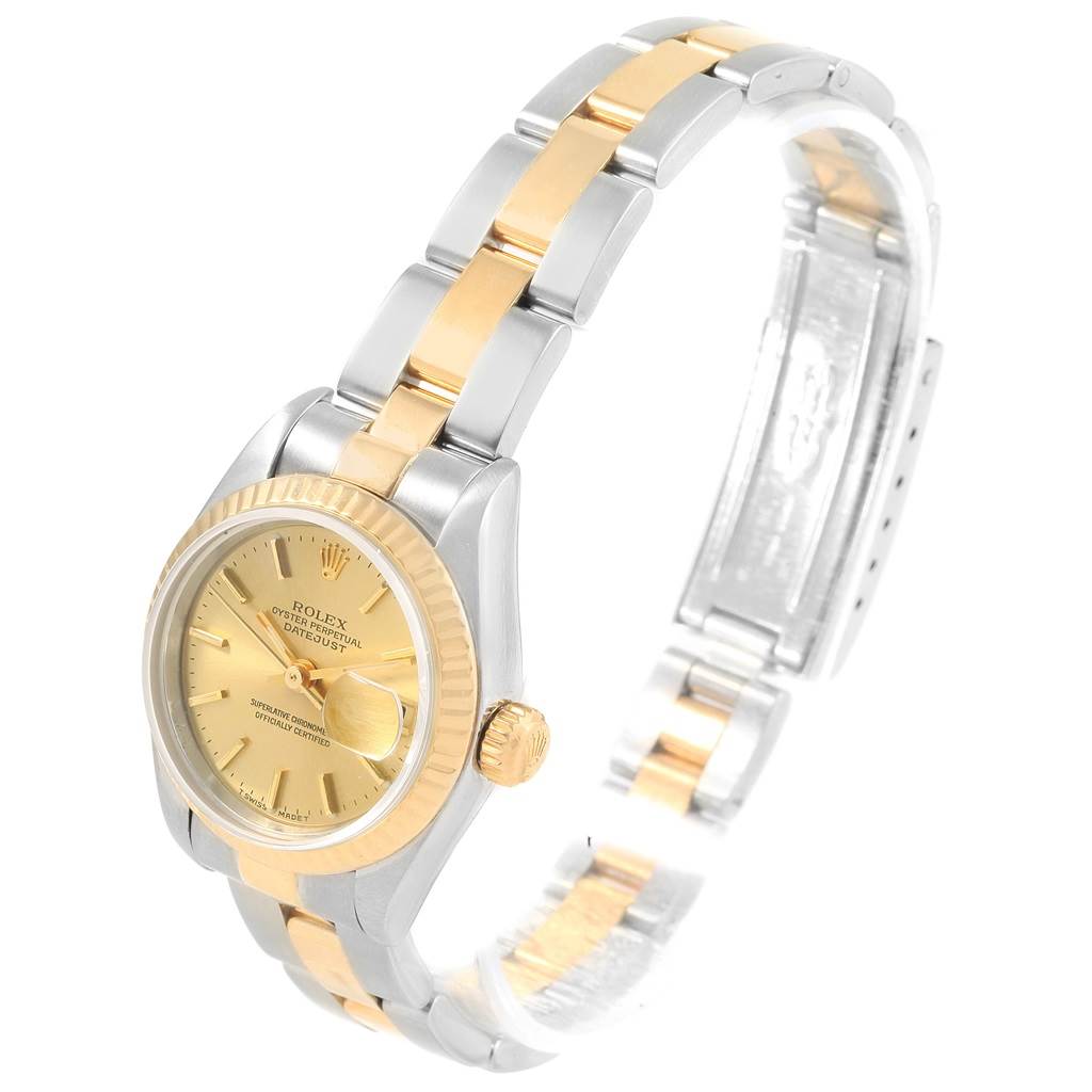 The image shows a Rolex Datejust 69173 Women
s Stainless Steel Champagne Dial 69173 Women
s Stainless Steel Champagne Dial watch at a slightly tilted angle, highlighting the face, bezel, and two-tone bracelet.