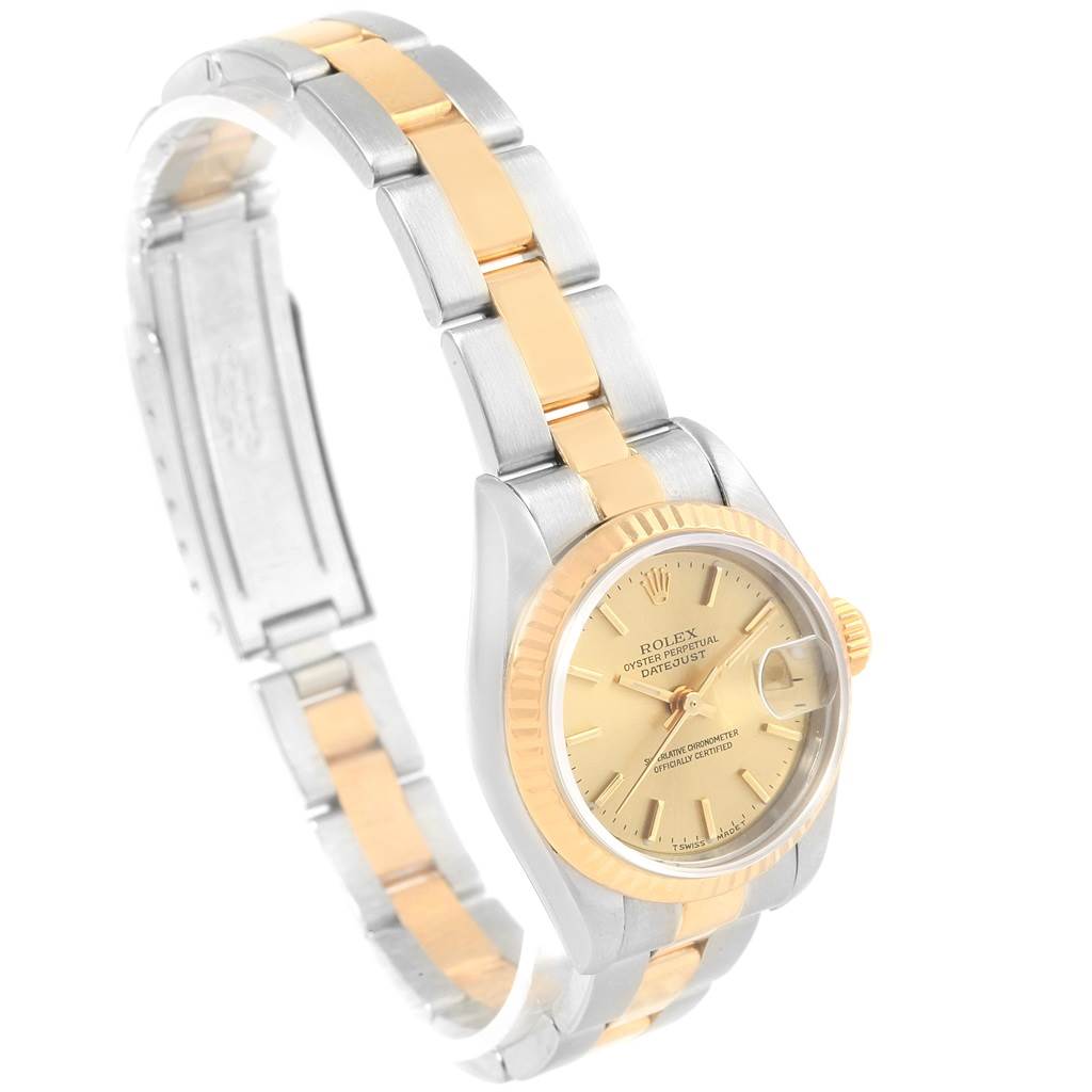 This image shows a side and front angle of a Rolex Datejust 69173 Women
s Stainless Steel Champagne Dial 69173 Women
s Stainless Steel Champagne Dial watch, highlighting its gold and silver bracelet, dial, and case.