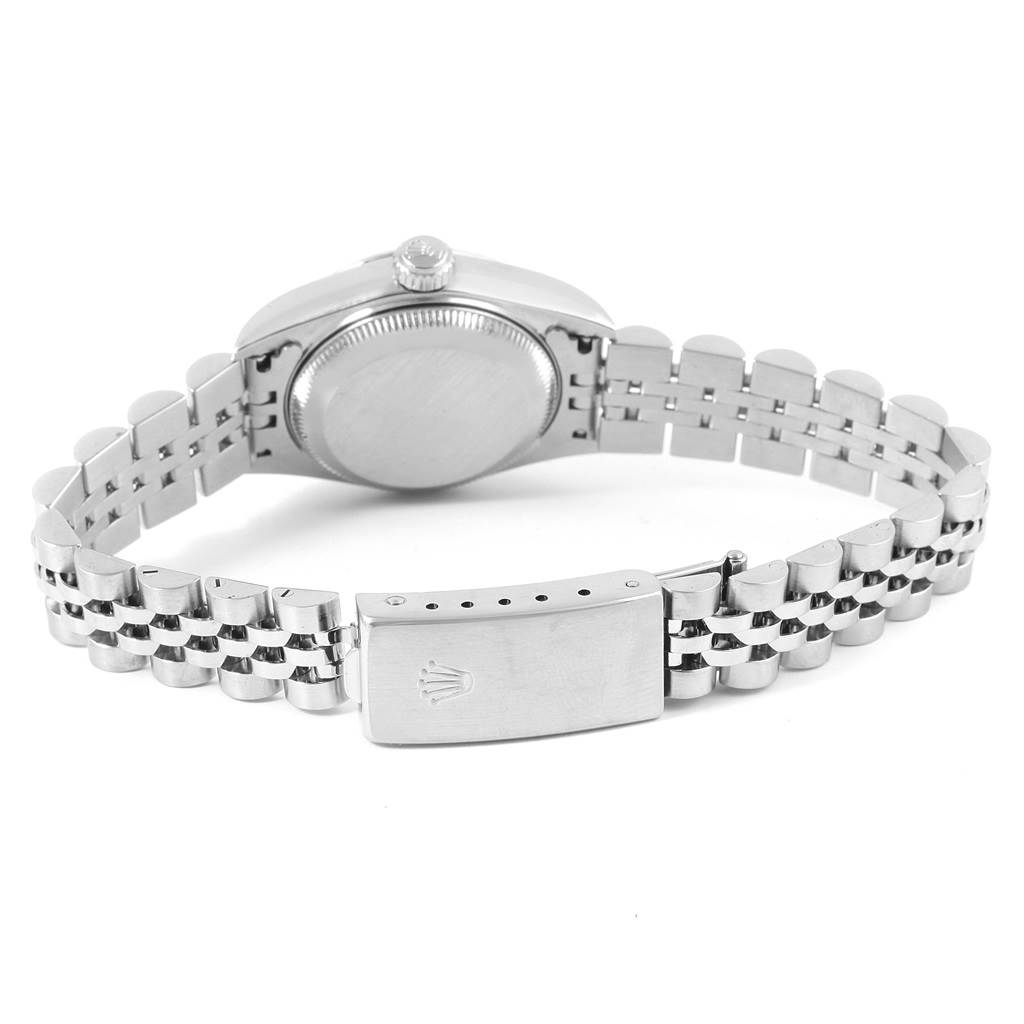 This Rolex Datejust 79174 Women
s Stainless Steel Silver Dial 79174 Women
s Stainless Steel Silver Dial watch is shown from the rear, highlighting its Jubilee bracelet and clasp.