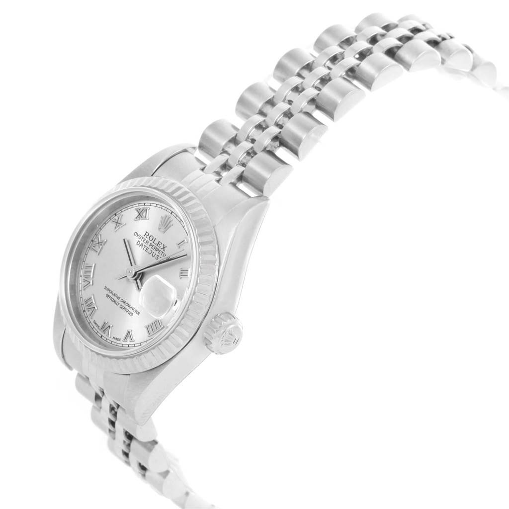 This image shows the Rolex Datejust 79174 Women
s Stainless Steel Silver Dial 79174 Women
s Stainless Steel Silver Dial watch at a three-quarter angle, highlighting the face, fluted bezel, and Jubilee bracelet.