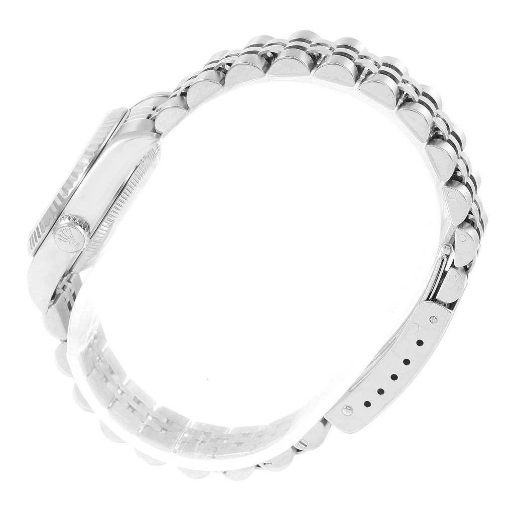 The image shows the side view of the Rolex Datejust 79174 Women
s Stainless Steel Silver Dial 79174 Women
s Stainless Steel Silver Dial watch, highlighting its crown, case, and bracelet.