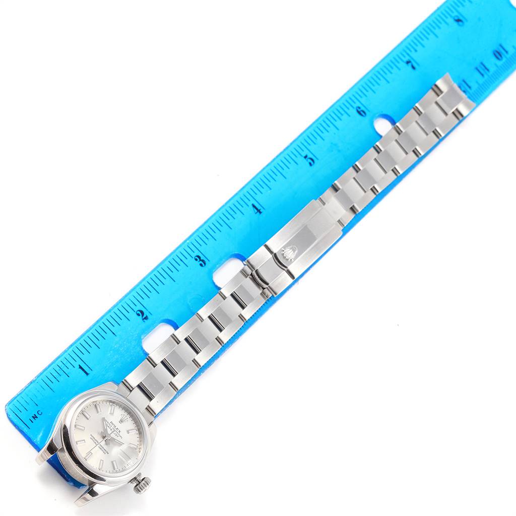 The image shows a Rolex Datejust 179160 Women's Stainless Steel Silver Dial 179160 Women's Stainless Steel Silver Dial watch with its bracelet extended beside a blue ruler for scale.