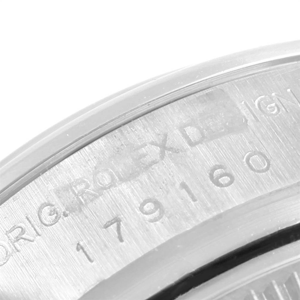 This image shows a close-up of the model and serial number engraving on the side of a Rolex Datejust 179160 Women's Stainless Steel Silver Dial 179160 Women's Stainless Steel Silver Dial watch.