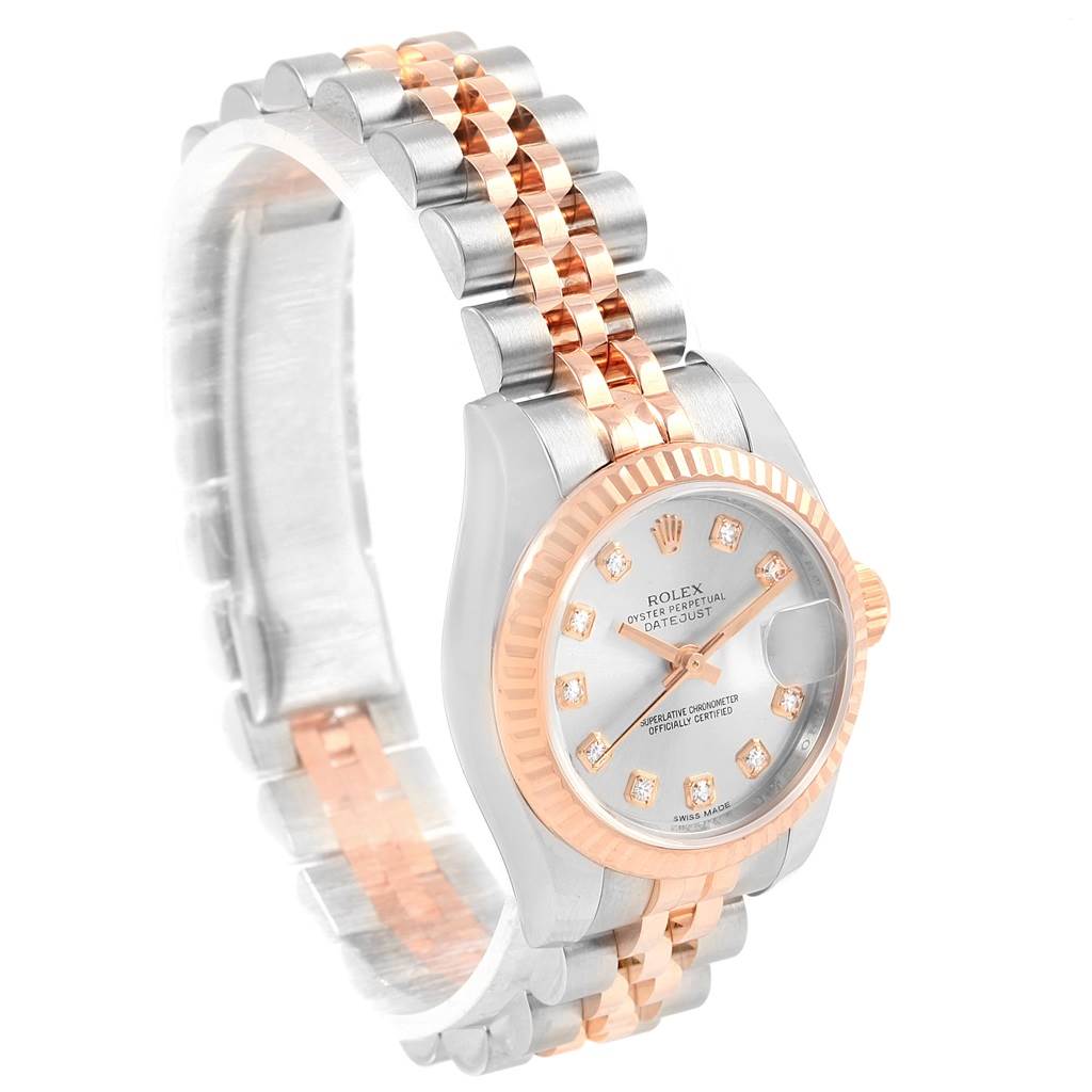 The image shows a side angle of the Rolex Datejust 179171 Women
s Steel and Gold (two tone) Silver Dial 179171 Women
s Steel and Gold (two tone) Silver Dial watch, highlighting its face, bezel, and two-tone bracelet.