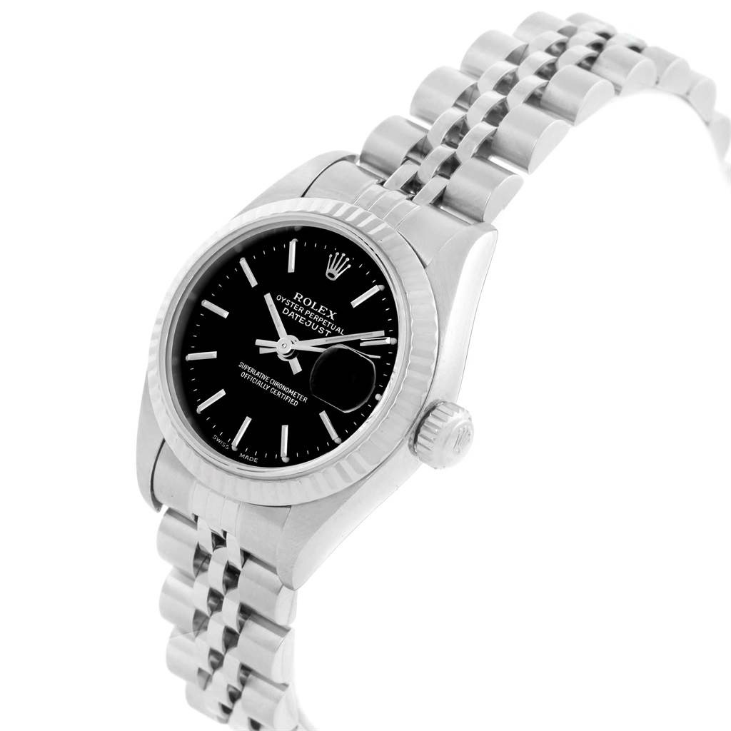The Rolex Datejust 79174 Women's Stainless Steel Black Dial 79174 Women's Stainless Steel Black Dial model watch is shown at a slight angle, displaying the face, bezel, and part of the bracelet.