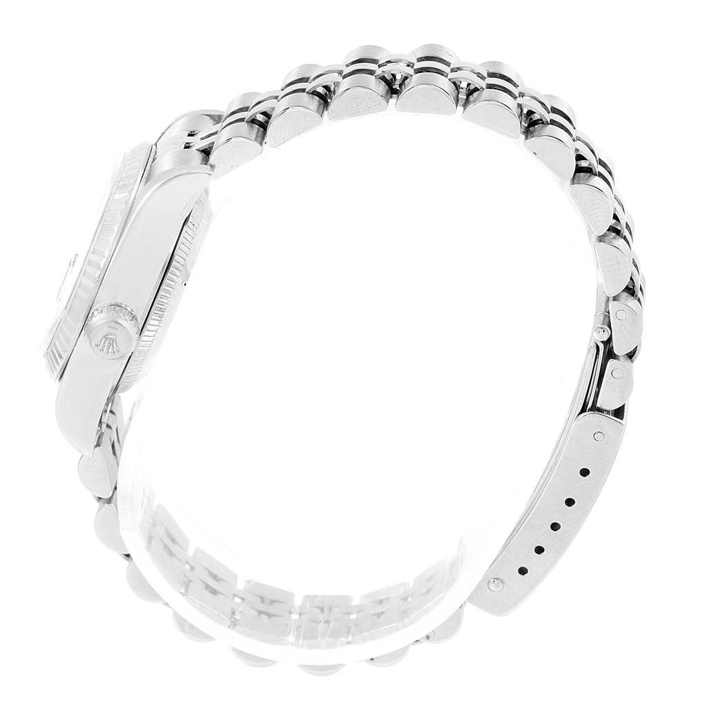 The image captures a side view of the Rolex Datejust 79174 Women's Stainless Steel Black Dial 79174 Women's Stainless Steel Black Dial watch, showcasing part of the case, bracelet, and clasp.