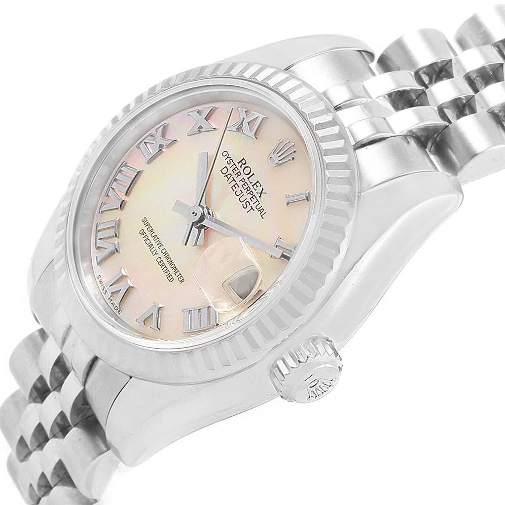 This image shows the Rolex Datejust 179174 Women
s Stainless Steel Mother of Pearl Dial 179174 Women
s Stainless Steel Mother of Pearl Dial watch at an angle highlighting the dial, fluted bezel, and part of the bracelet.