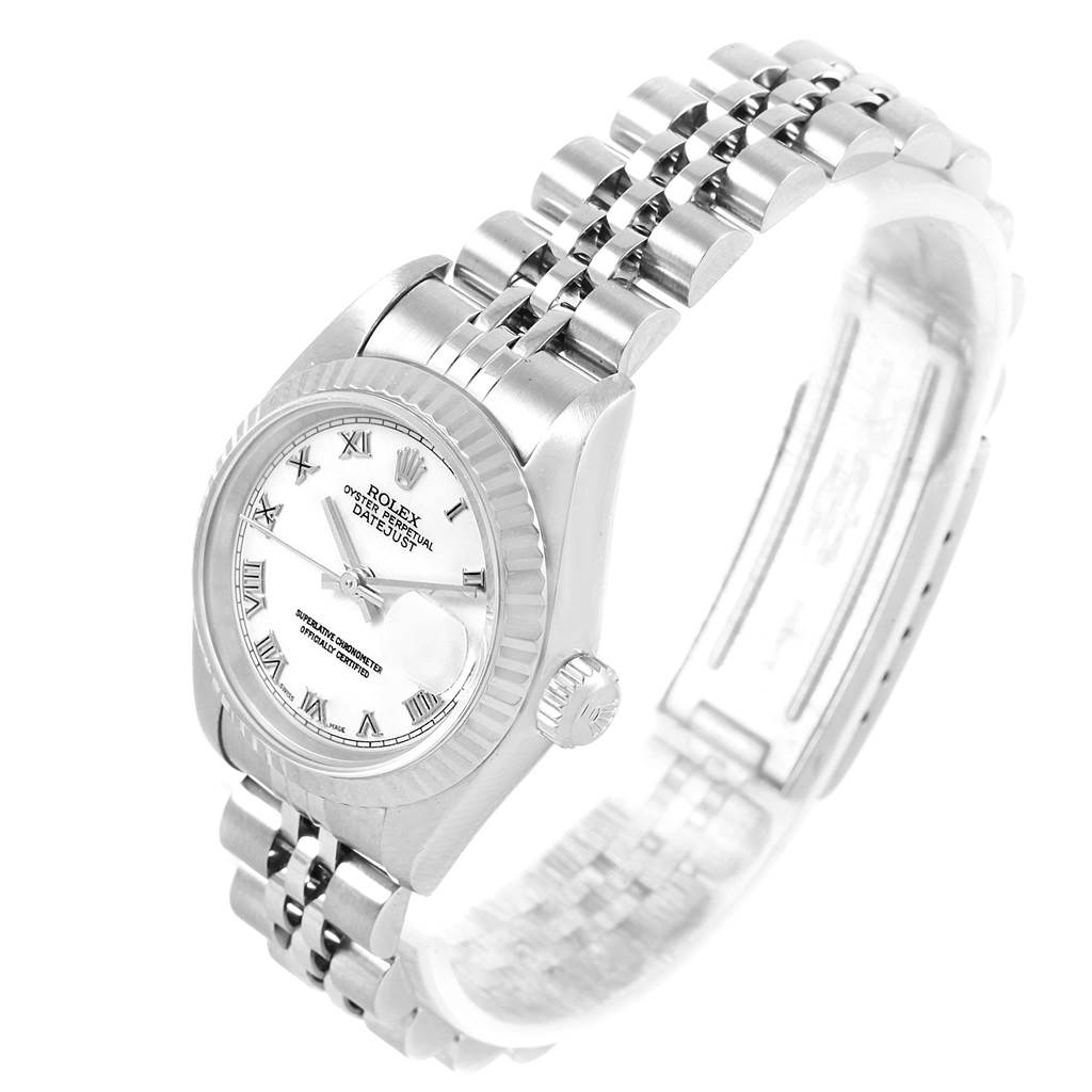 The image shows the Rolex Datejust 79174 Women
s Stainless Steel White Dial 79174 Women
s Stainless Steel White Dial watch at an angled side view featuring its dial, bezel, crown, and bracelet.