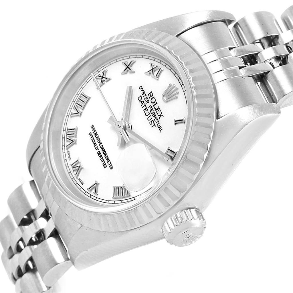 The image shows a Rolex Datejust 79174 Women
s Stainless Steel White Dial 79174 Women
s Stainless Steel White Dial watch at an angled side view, highlighting the dial, bezel, crown, and part of the bracelet.