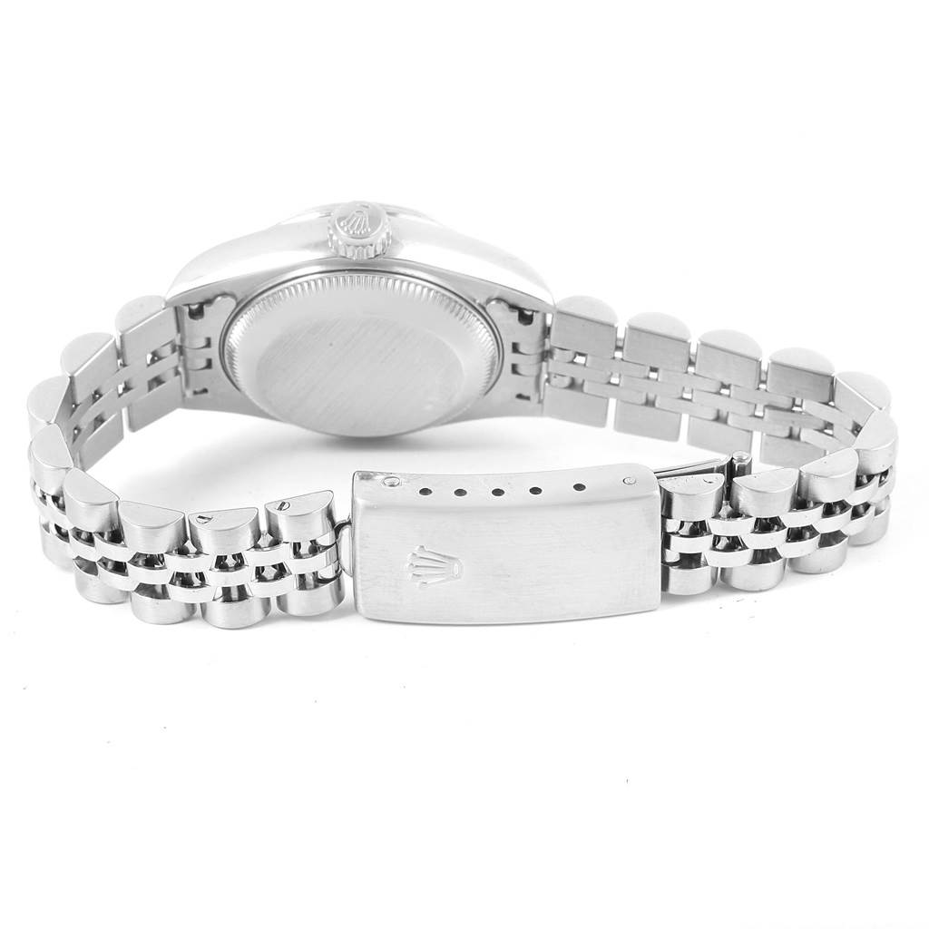 The image shows the back view of a Rolex Datejust 79174 Women
s Stainless Steel White Dial 79174 Women
s Stainless Steel White Dial watch, highlighting the case back, crown, and clasp on the bracelet.