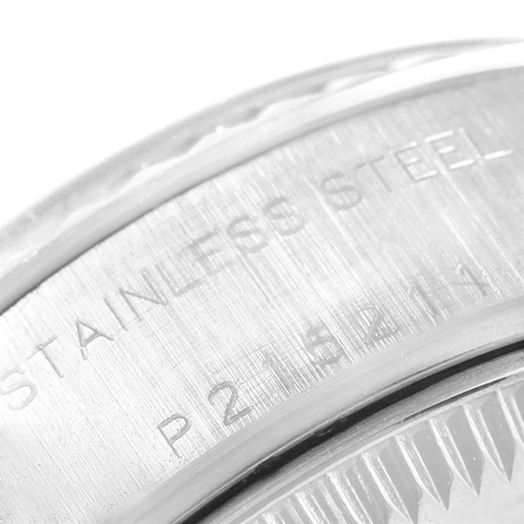 The image shows a close-up of the case back of a Rolex Datejust 79174 Women
s Stainless Steel White Dial 79174 Women
s Stainless Steel White Dial watch, highlighting the stainless steel engraving.