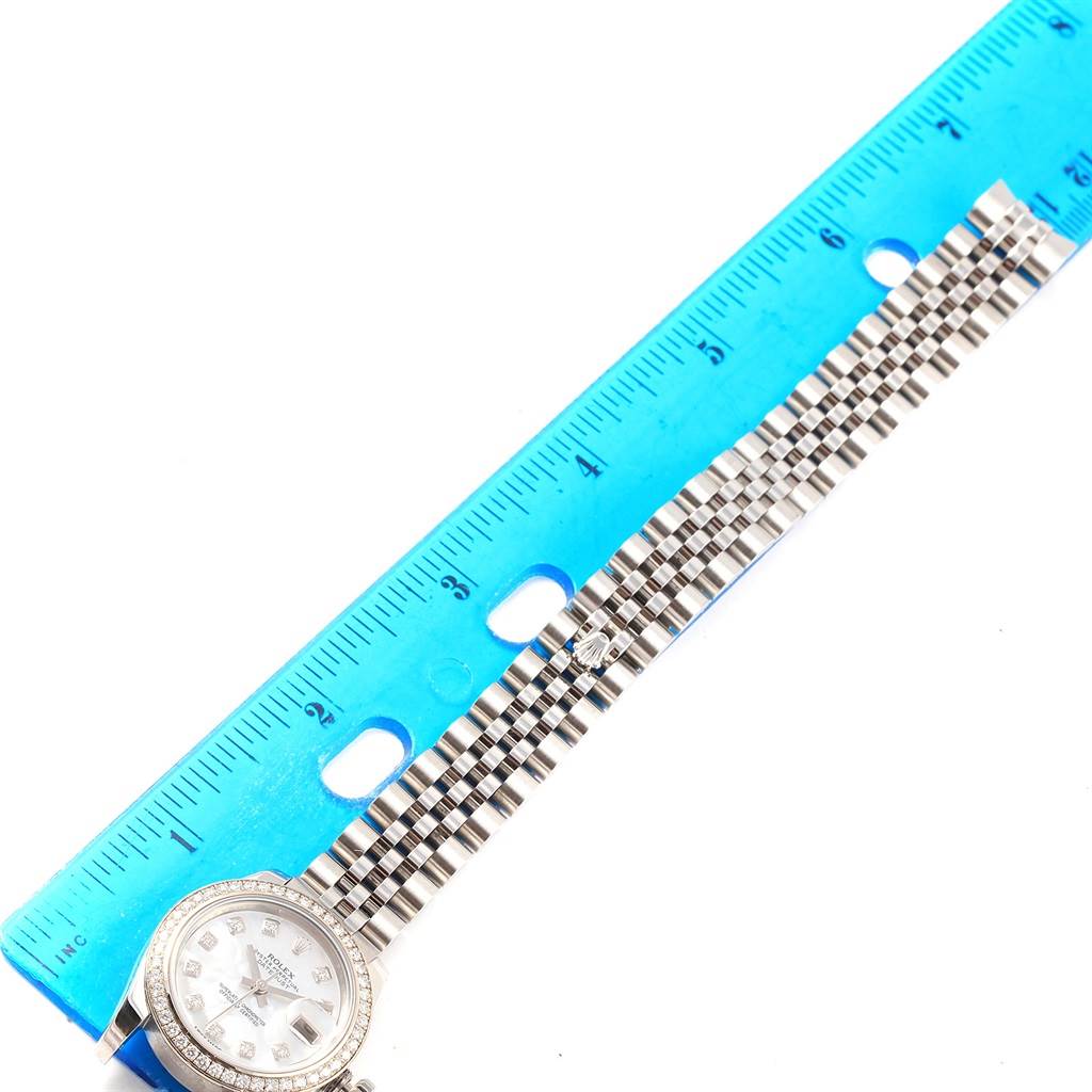 The image shows a Rolex Datejust 179384 Women's Stainless Steel Mother of Pearl Dial 179384 Women's Stainless Steel Mother of Pearl Dial watch face and part of the bracelet, measured against a blue ruler.