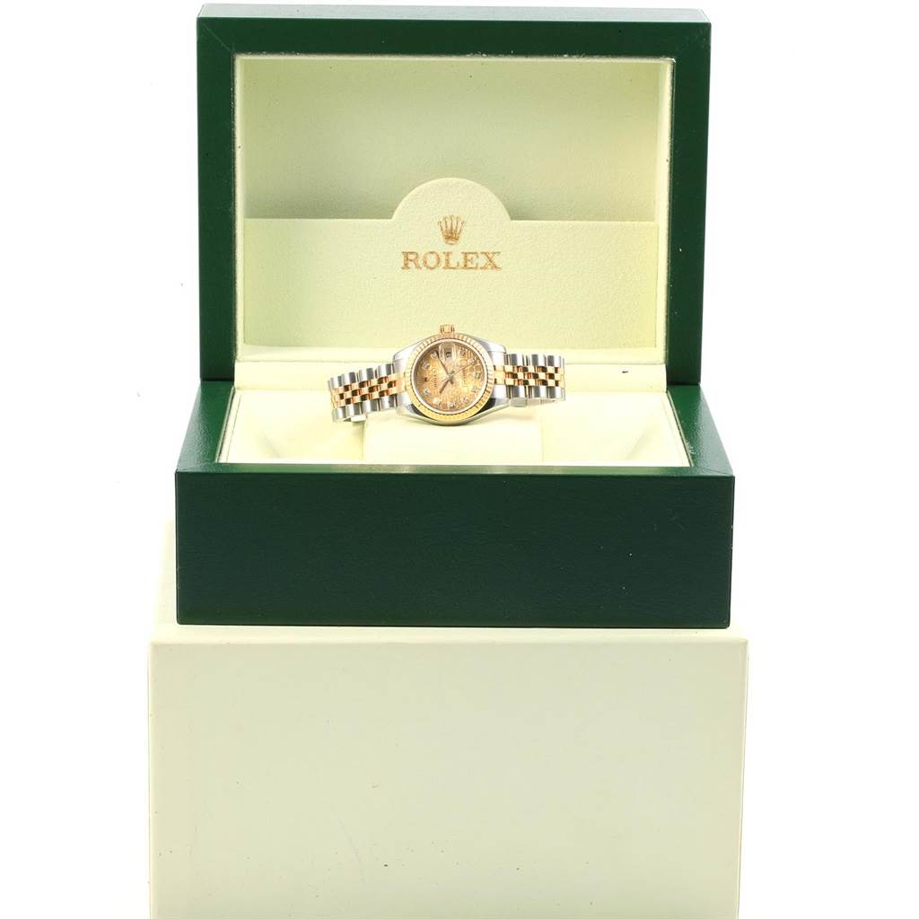 The Rolex Datejust 179173 Women's Steel and Gold (two tone) Champagne Dial 179173 Women's Steel and Gold (two tone) Champagne Dial watch is displayed front-on in its open green box.