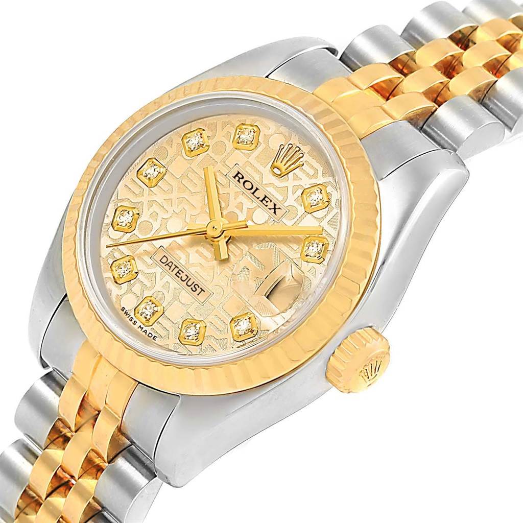 This image shows the Rolex Datejust 179173 Women's Steel and Gold (two tone) Champagne Dial 179173 Women's Steel and Gold (two tone) Champagne Dial watch from an angled side view, highlighting the dial, crown, and part of the bracelet.