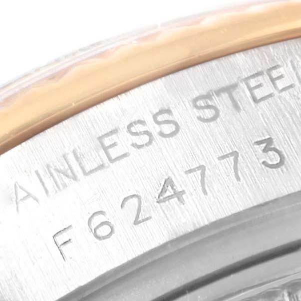 The image shows a close-up of the engraved serial number on the stainless steel side of a Rolex Datejust 179173 Women's Steel and Gold (two tone) Champagne Dial 179173 Women's Steel and Gold (two tone) Champagne Dial watch.