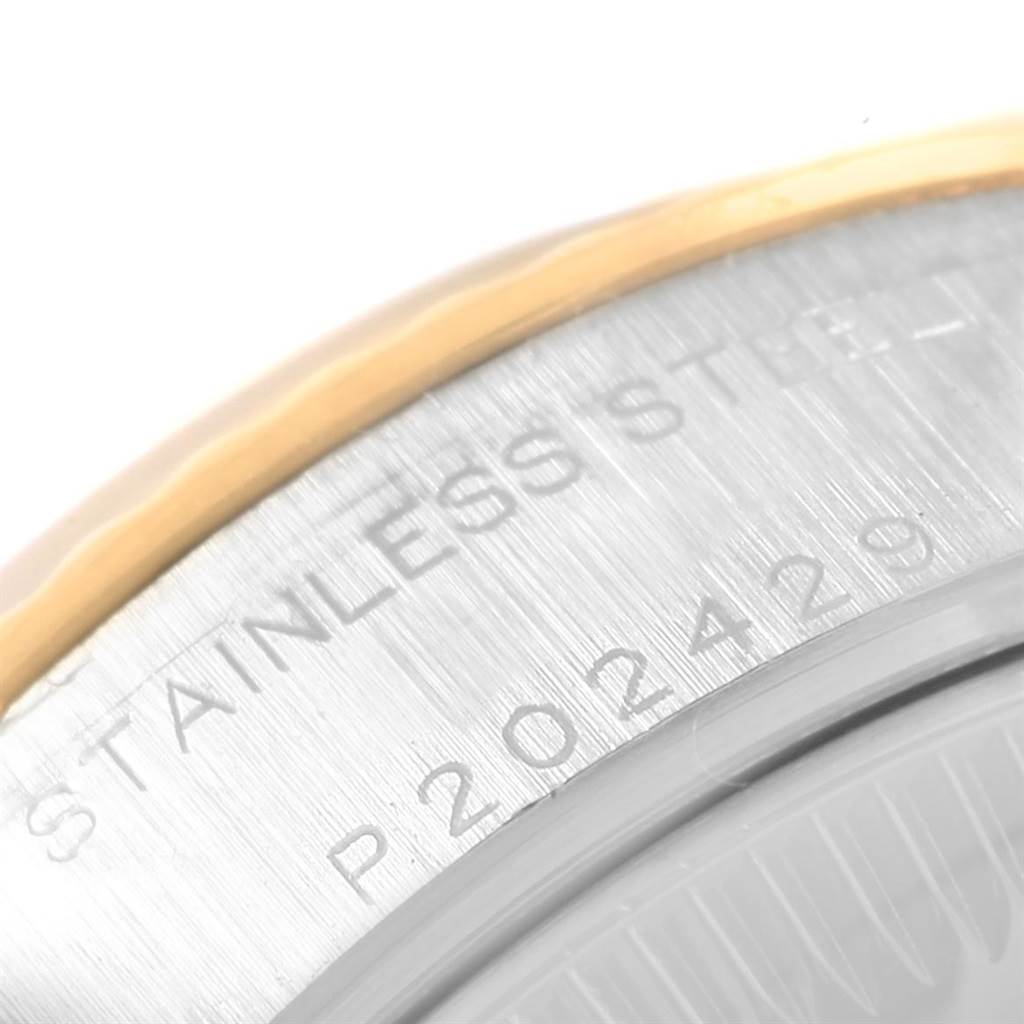 This close-up angle shows the watch's stainless steel case back with etched text on a Rolex Datejust 79173 Women's Steel and Gold (two tone) Black Dial 79173 Women's Steel and Gold (two tone) Black Dial model.
