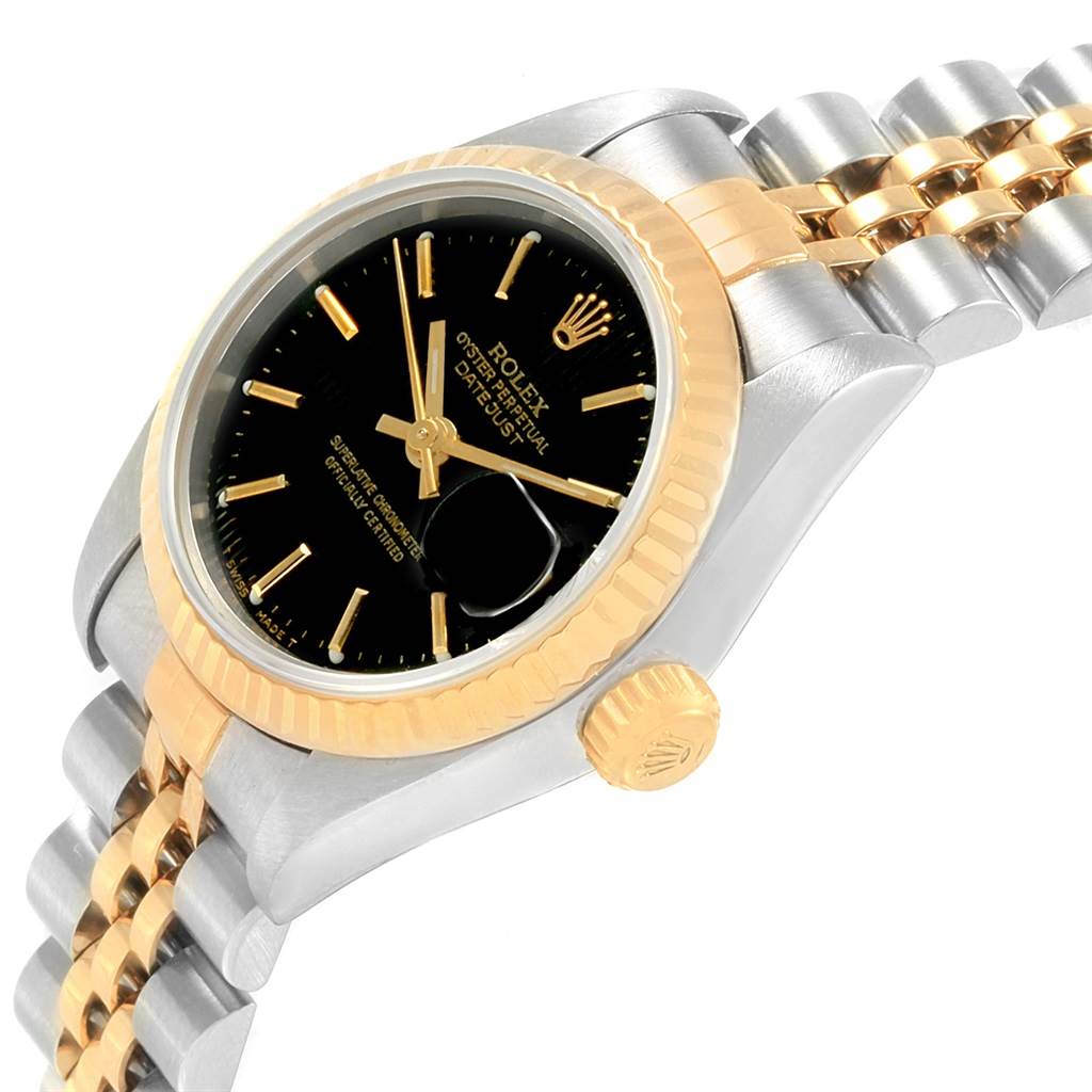 This image shows a close-up angled view of the Rolex Datejust 79173 Women's Steel and Gold (two tone) Black Dial 79173 Women's Steel and Gold (two tone) Black Dial watch, highlighting its bezel, dial, crown, and a portion of the bracelet.