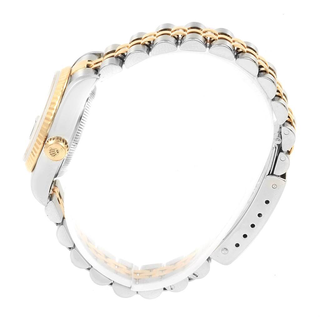 The image shows a side view of a Rolex Datejust 79173 Women's Steel and Gold (two tone) Black Dial 79173 Women's Steel and Gold (two tone) Black Dial watch, highlighting the crown, case, and two-tone bracelet.