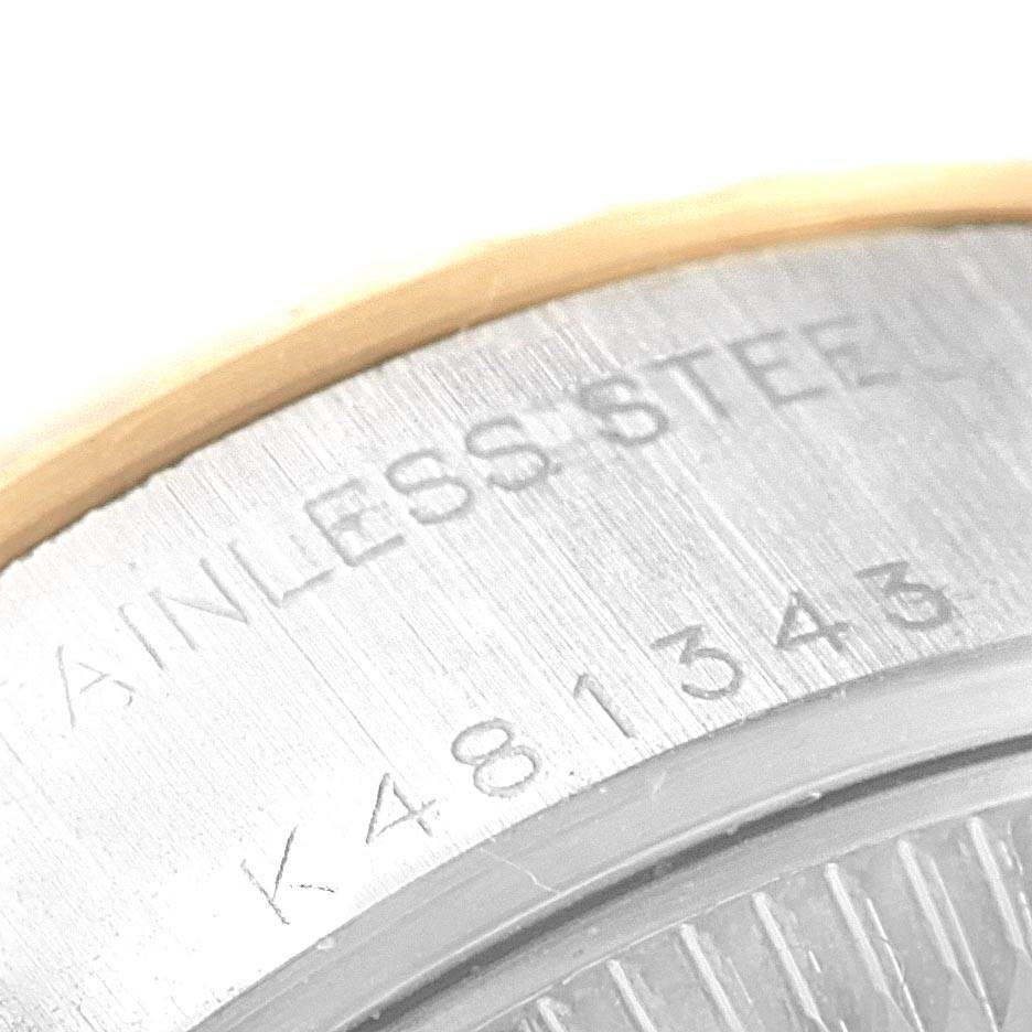 This image shows a close-up angle of the serial number and "STAINLESS STEEL" engraving on the case back of a Rolex Datejust 79173 Women's Steel and Gold (two tone) Champagne Dial 79173 Women's Steel and Gold (two tone) Champagne Dial watch.