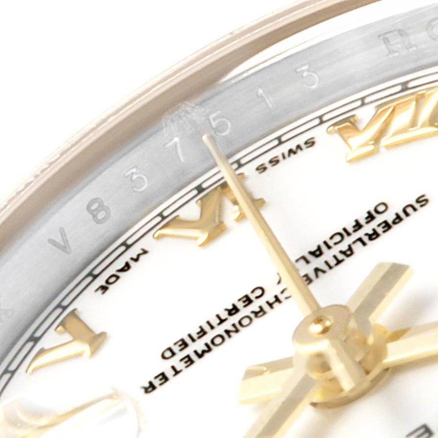 This close-up image shows the dial and Roman numeral markers of a Rolex Datejust 179173 Women's Steel and Gold (two tone) White Dial 179173 Women's Steel and Gold (two tone) White Dial watch, focusing on the watch's hands and text details.