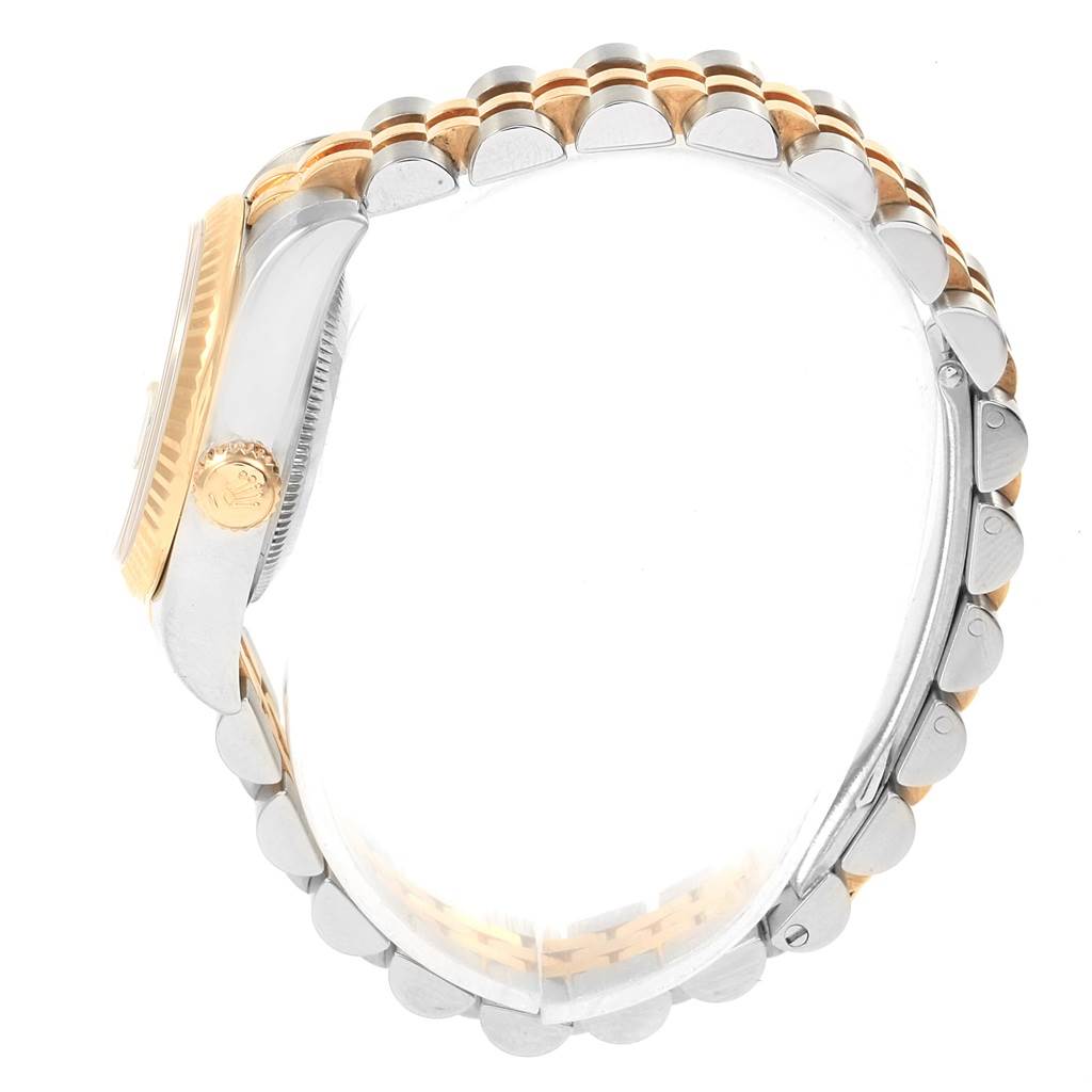 This image shows a side view of the Rolex Datejust 179173 Women's Steel and Gold (two tone) White Dial 179173 Women's Steel and Gold (two tone) White Dial watch, highlighting its two-tone bracelet and crown.