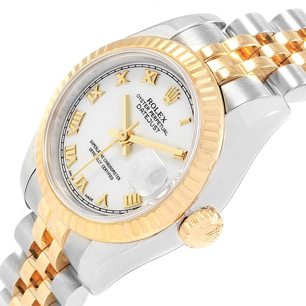 This image shows a Rolex Datejust 179173 Women's Steel and Gold (two tone) White Dial 179173 Women's Steel and Gold (two tone) White Dial watch from an angled close-up, highlighting the dial, crown, and bracelet.