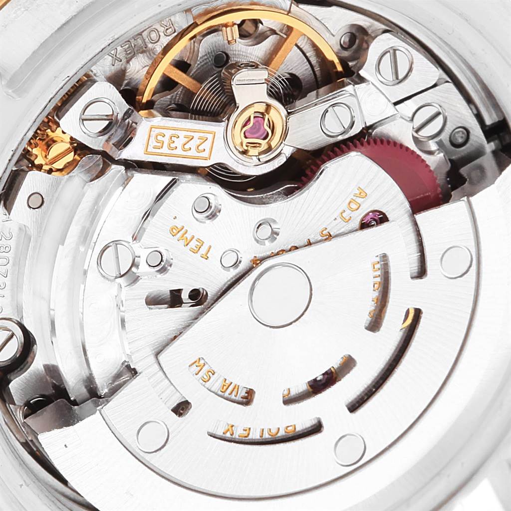 This image shows a close-up of the Datejust model by Rolex, focusing on its intricate mechanical movement and parts.