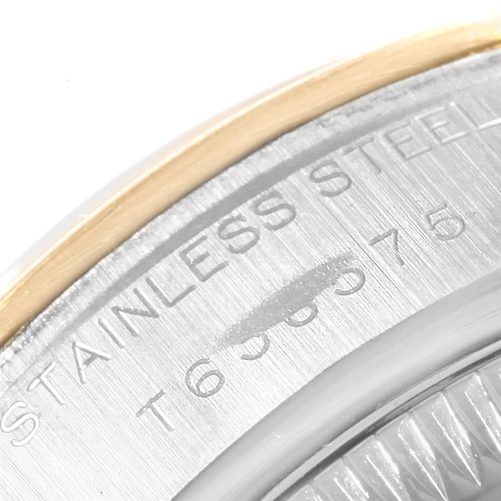 The image shows a close-up of the side of a Rolex Datejust 69163 Women's Steel and Gold (two tone) Grey Dial 69163 Women's Steel and Gold (two tone) Grey Dial watch with part of the bezel and engraved "STAINLESS STEEL."