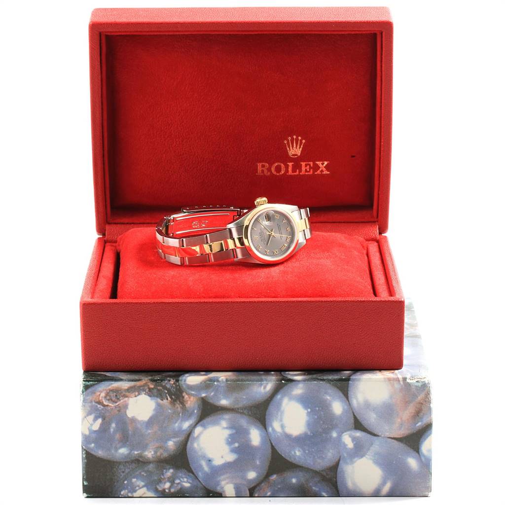 The Rolex Datejust 69163 Women's Steel and Gold (two tone) Grey Dial 69163 Women's Steel and Gold (two tone) Grey Dial watch is displayed in an open red box, showing the band and face from a front angle.