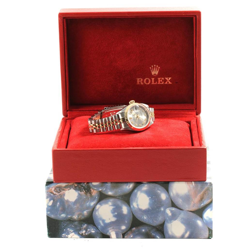 The image shows a Rolex Datejust 79173 Women's Steel and Gold (two tone) Grey Dial 79173 Women's Steel and Gold (two tone) Grey Dial watch displayed at a slight angle inside an open red box.