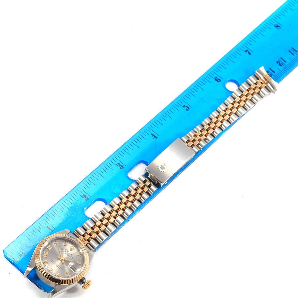 The Rolex Datejust 79173 Women's Steel and Gold (two tone) Grey Dial 79173 Women's Steel and Gold (two tone) Grey Dial watch is shown from a top-down angle, displaying the dial, bezel, crown, and bracelet.