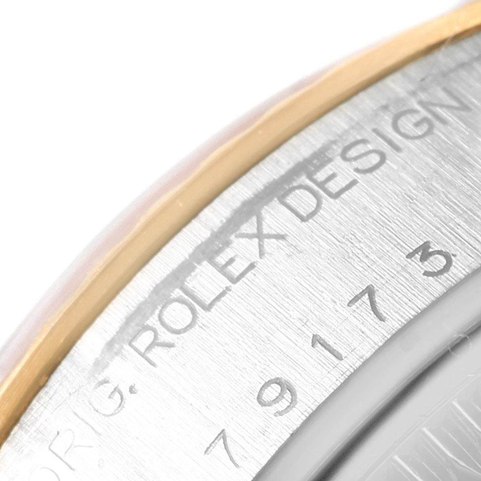 This close-up image shows the engraved side of the Rolex Datejust 79173 Women's Stainless Steel Black Dial 79173 Women's Stainless Steel Black Dial watch case.