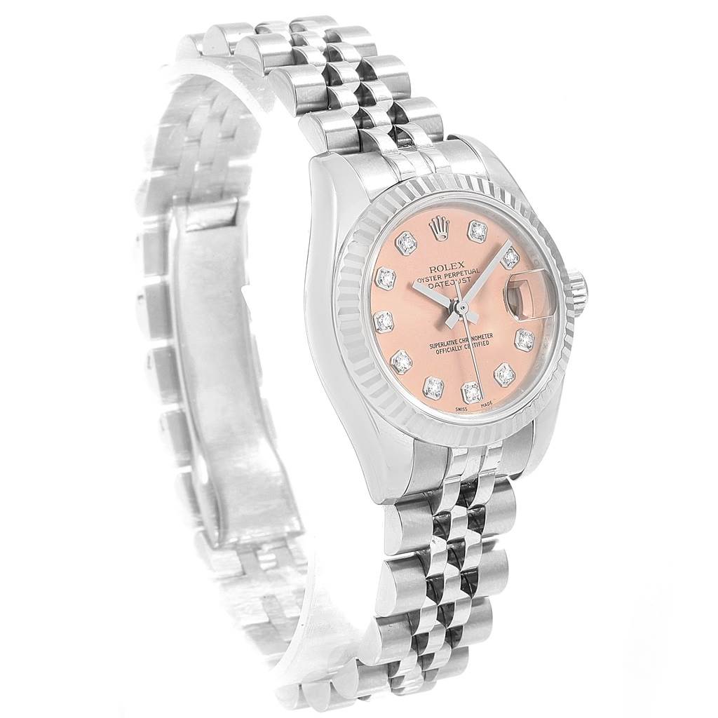 This image showcases the Rolex Datejust 179174 Women
s Stainless Steel Pink Dial 179174 Women
s Stainless Steel Pink Dial watch at an angled side view, highlighting its bezel, dial, and stainless steel bracelet.